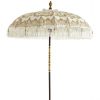 White and gold vintage umbrella with tassels. Wooden pole.