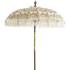White and gold vintage umbrella with tassels. Wooden pole.