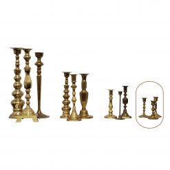 mismatched small brass candlesticks