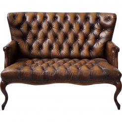 Brown leather loveseat with tufted seat and back. Curved ornate wooden legs.