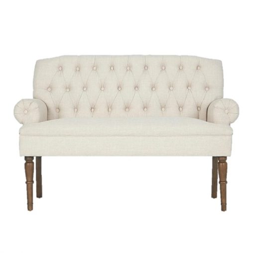 Cream colored loveseat with tufted back, rolled arms, and brown wooden legs