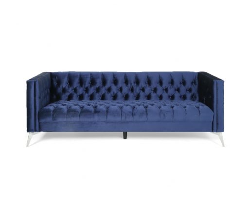Midnight blue velvet sofa with mid-century modern charm, tufted on the seat and back, and silver legs.