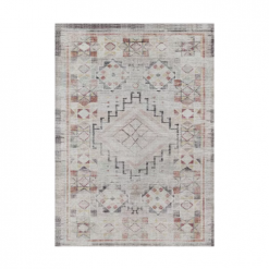 Faded distressed rug with a geometric design in rust, yellow, gray, and off white.