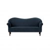 Navy blue velvet sofa with a wavy back and wooden legs