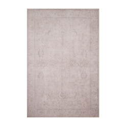 Sand colored area rug with faded design