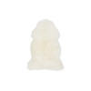 Furry fake white lambskin rug in the shape of a lamb's hide.
