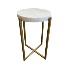 Short accent table with white marble top and 4 gold straight legs that make a 90 degree turn at the bottom and cross into an X.