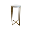 Tall and skinny side table with round white marble top and gold clean lines for the legs coming to an X at the bottom.