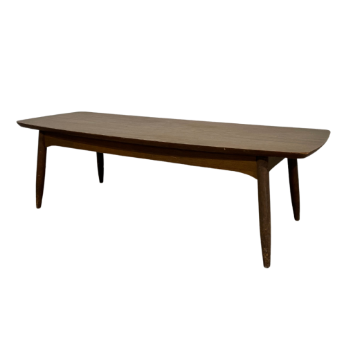 Side angle of brown rectangular coffee table with round edges. Thick lip under the top.
