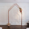 Colleen Copper Arch Backdrop used in wedding ceremony - chairs up front. Florals on arch.