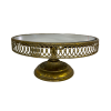 Round cake gold stand with a lattice edge and a mirror top.