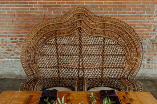 Double peacock throne chair at a wedding reception head table