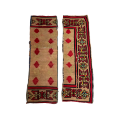 Pair of Maya boho runners. Formerly a full area rug, it has been cut into two strips. Thick border with geometric designs in yellow, green, and red. Large red diamonds in rows inside the border