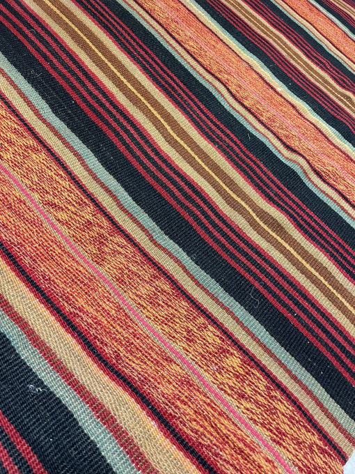 Close up of stripes in the runner - red, black, teal, yellow