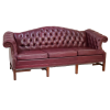 Side view of a maroon chesterfield sofa