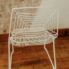 Back side angle of our modern white wire chair