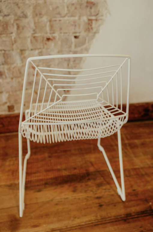Back side angle of our modern white wire chair