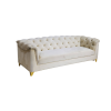 White velvet sofa, side view. Tufted back that rolls over the arms. Solid long cushion.