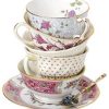 Mismatched teaccups/saucers. Stacked.