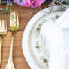 Mismatched gold china in a tablescape