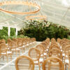 Louis cane back chairs set up for a wedding ceremony.