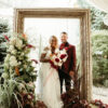 Bride and groom photo shoot with an oversized frame