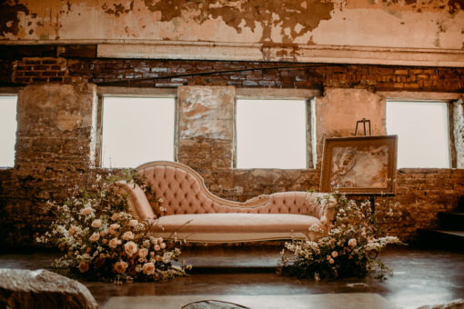 Soft pink fainting sofa with large florals at the North Church Venue in Muncie