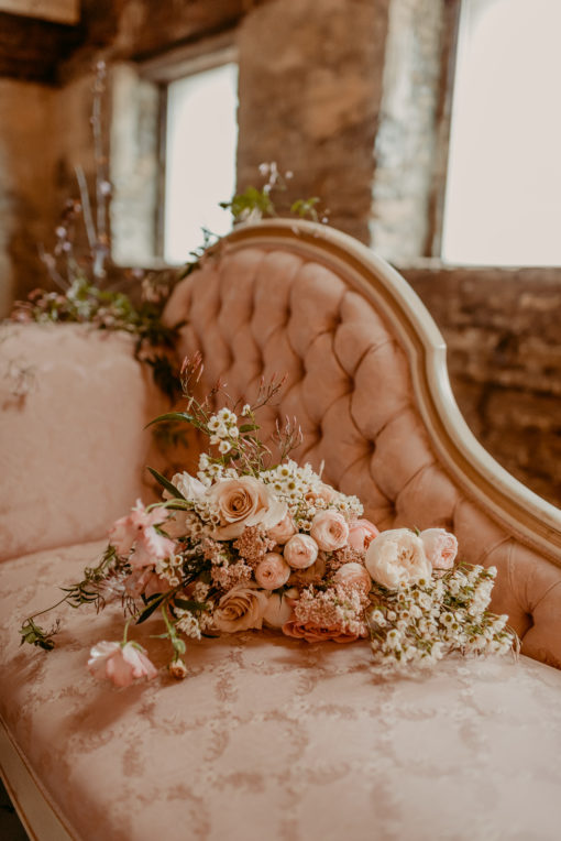 Close up view of the tufted back buttons with light pink florals