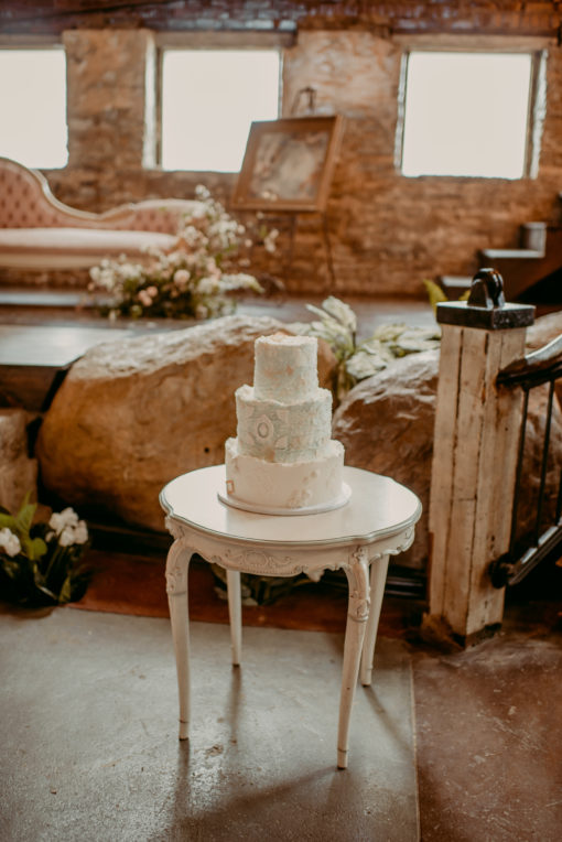 Small round vintage table cake display at the North Church Venue in Muncie