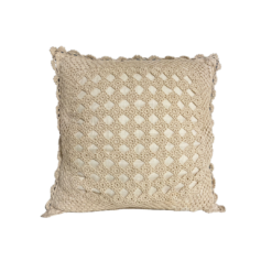 Square knit pillow in cream. Small open squares expose the pillow