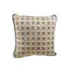 Tan square pillow with small organized squares in light blue, olive, and brown