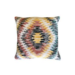 multicolored pillow with amber, burnt orange, and teal geometric design