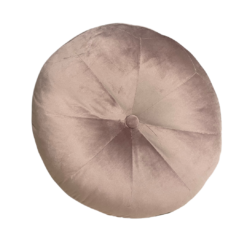 Oversized light pink round velvet pillow cushion with a button in the middle.