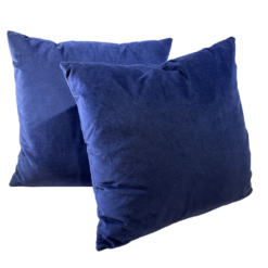 Navy velvet square pillows with a white background