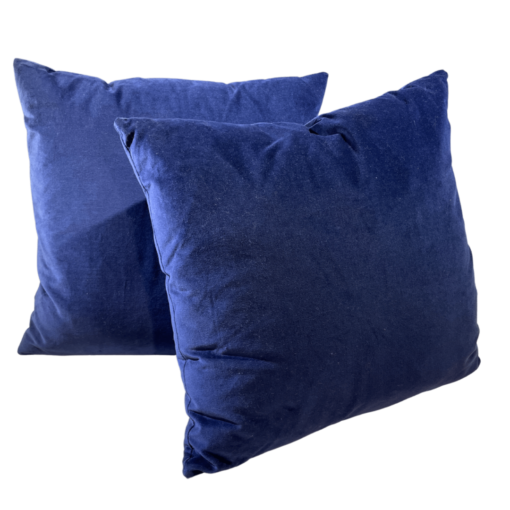 Navy velvet square pillows with a white background