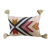 Rectangular pillow with bold lines and angles. Tassels on the corners