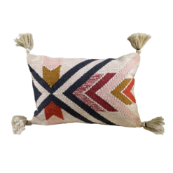 Rectangular pillow with bold lines and angles. Tassels on the corners