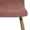 Close up of chair edge. Textured soft fabric with round edges. Gold metal legs