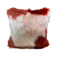 Square furry pillow with rust, white, and pink coloring