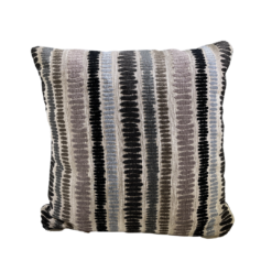 Striped pillow in beige with black, brown, tan, and light blue stripes
