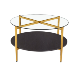 Modern round coffee table with glass top, gold legs that form an X on the top, and a black bottom shelf