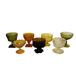 Seven 4 inch Mismatched Colored Dessert Glasses in a variety of colors such as olive, amber, yellow, and clear.
