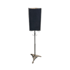 Black slate two sided chalkboard on a freestanding metal stand with ornate feet.