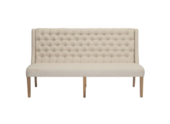 6 foot long armless loveseat with a highback in beige fabric with button tufts on the back.