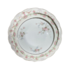 Set of 3 vintage china plates in 3 different sizes stacked on top of each other. Mismatched pink patterns on white background