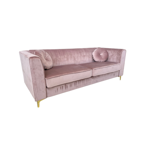 Soft pink velvet sofa with tufted back, two large cushions, square arms and gold legs. Includes two round matching pillows. Side view