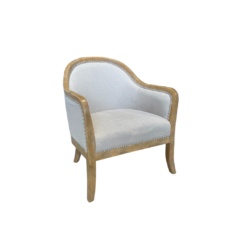 Armchair with light wood frame around the top, down the arms, and into the legs. Soft beige fabric on seat, back, and around the back of the chair. Silver nailhead trim.