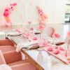 Pink velvet armchairs for breast cancer awareness at a dinner party table