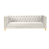 White velvet square sofa with button tufting and gold nailhead trim and legs