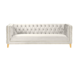 White velvet square sofa with button tufting and gold nailhead trim and legs
